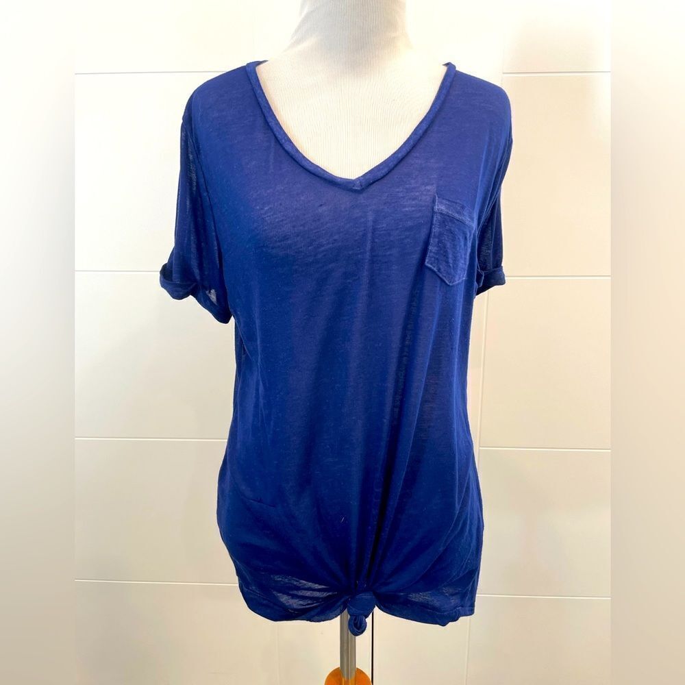 Blue v neck, slightly sheer, knot in front, small run in fabric.